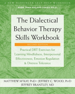 Paperback DBT Skills Workbook by New Harbinger Publications featuring practical mindfulness, emotion regulation, and interpersonal exercises.