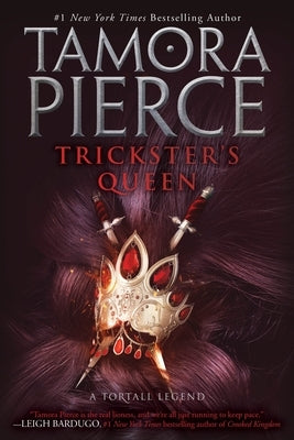 Paperback of Trickster's Queen by Random House Children's Books, showing the book cover with fantasy artwork and title text.
