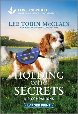 Mass market paperback of "Holding Onto Secrets," an uplifting romantic novel by Love Inspired Larger Print, featuring a heartfelt cover.