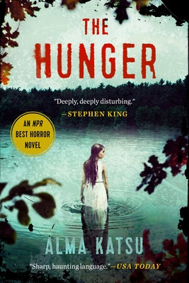Paperback copy of The Hunger novel by G.P. Putnam's Sons, featuring the book cover with dark and intense artwork.