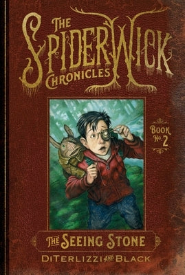 Paperback of The Seeing Stone by Simon & Schuster Books for Young Readers, featuring the book cover with mystical artwork.
