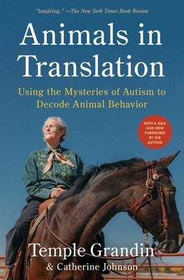 Paperback of "Animals in Translation" by Scribner Book Company, showing the book cover with animals and text.