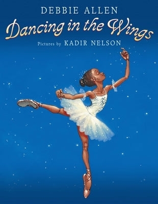 Paperback copy of "Dancing in the Wings" by Puffin Books showing the book cover with colorful artwork and title.