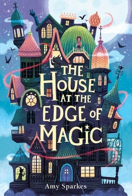 Paperback copy of "The House at the Edge of Magic" by Margaret K. McElderry Books, showing the book cover with colorful illustrations.