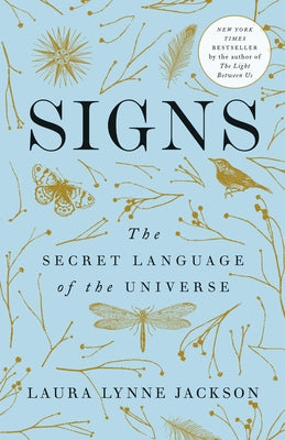 Paperback copy of "Signs: The Secret Language of the Universe" by Dial Press, featuring a colorful cover with celestial imagery.