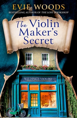 Paperback of The Violin Maker's Secret by HarperCollins showing the book cover with intricate violin imagery and title text.