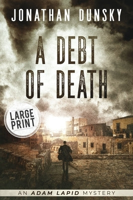 Paperback copy of "A Debt of Death" by Lion Cub Publishing, featuring the book cover with dark and dramatic artwork.