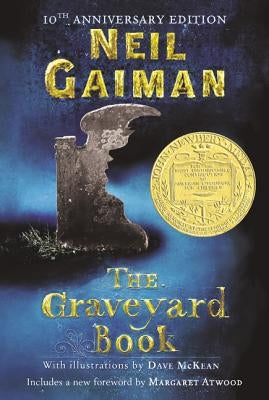 Paperback copy of The Graveyard Book by HarperCollins showing the front cover with dark, spooky artwork.