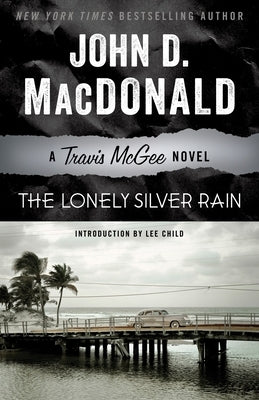 Paperback copy of "The Lonely Silver Rain" by Travis McGee, published by Random House Trade, showing the book cover with title and author.