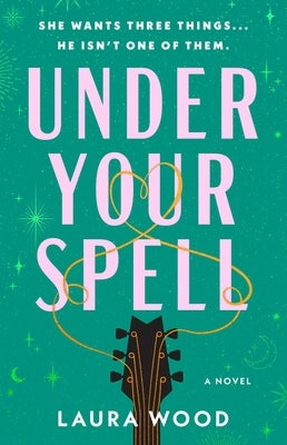 Paperback of "Under Your Spell" by Atria Books, showing the book cover with dark, mystical design and title text.