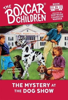 Paperback copy of "The Mystery at the Dog Show" by Random House Books for Young Readers, featuring a colorful cover illustration.