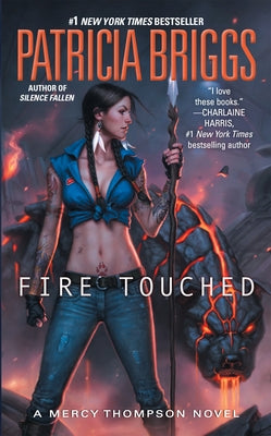 Fire Touched mass market paperback by Ace Books showing the book cover with dark fantasy artwork and title text.