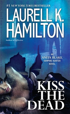 Mass market paperback of "Kiss the Dead" by Anita Blake Vampire Hunter novel, published by Berkley Books, featuring a dark, mysterious cover.