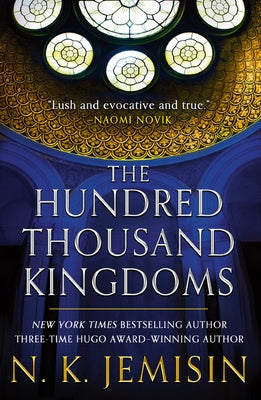 Paperback of The Hundred Thousand Kingdoms by Orbit, featuring a book cover with intricate artwork and title text.