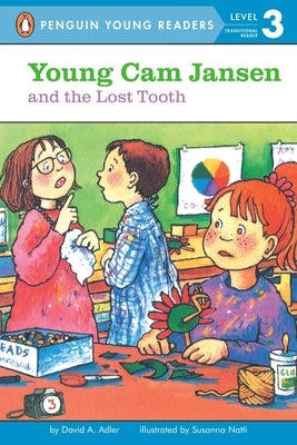 Paperback of Young Cam Jansen and the Lost Tooth by Penguin Young Readers Group, featuring the book cover with colorful illustrations.