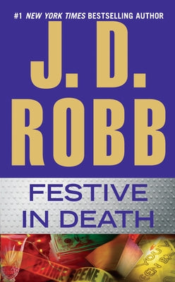 Mass market paperbound copy of "Festive in Death" by Berkley Books featuring a festive-themed cover design.