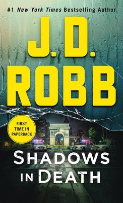 Mass market paperback of Shadows in Death by Eve Dallas novel, featuring dark, mysterious cover art.