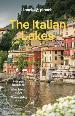 Paperback copy of Lonely Planet's Italy Lakes travel guide showing the cover with scenic Italian lake views.