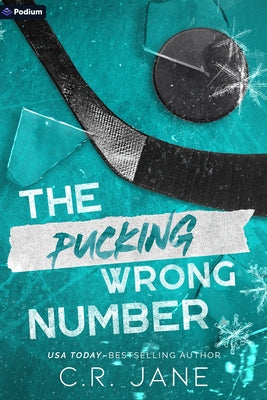 Paperback copy of "The Pucking Wrong Number," a hockey romance novel published by Podium Publishing, featuring a sports-themed cover.