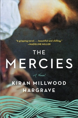 Paperback copy of The Mercies novel by Back Bay Books featuring a cover image with artwork and title text.
