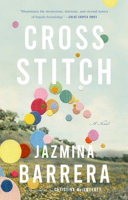 Paperback cross-stitch book by Two Lines Press featuring colorful embroidery patterns and detailed stitch instructions.