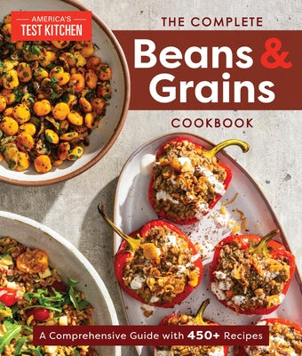 Paperback cookbook by America's Test Kitchen featuring beans and grains, with colorful images of recipes and ingredients on the cover.