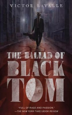 Paperback copy of The Ballad of Black Tom by Tordotcom, featuring the book's cover with dark and mysterious artwork.
