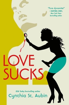 Paperback copy of "Love Sucks" by Tor Books, featuring the book cover with bold title and illustrative artwork.