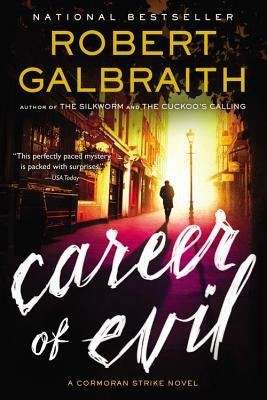 Paperback copy of Career of Evil by Mulholland Books featuring the book cover with dark, ominous artwork.