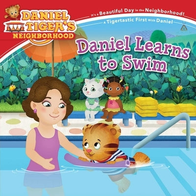 Daniel learns to swim paperback book by Simon Spotlight, featuring colorful illustrations of a young boy swimming.