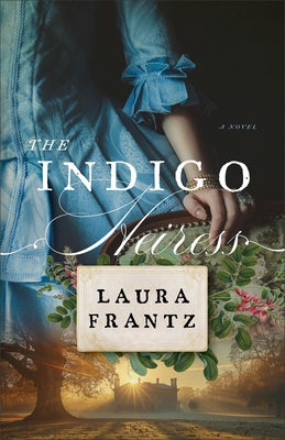 Paperback of The Indigo Heiress by Fleming H. Revell Company with a cover featuring a woman in a blue dress and vintage design.