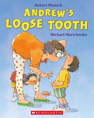 A paperback copy of Andrew's Loose Tooth by Scholastic Canada, featuring a colorful illustrated cover depicting a young boy losing a tooth.