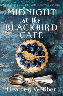 Paperback of "Midnight at the Blackbird Cafe" by Forge, featuring a cozy, illustrated cover with a blackbird and cafe scene.