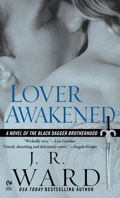 Cover of Lover Awakened mass market paperback by Berkley Books featuring a dark, romantic scene with a mysterious vampire character.