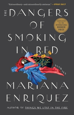 Paperback copy of "The Dangers of Smoking in Bed: Stories" by Hogarth Press, featuring a close-up of the book cover.