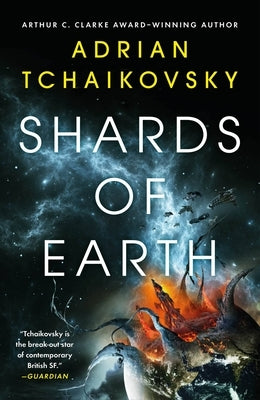 Paperback copy of "Shards of Earth" by Orbit, featuring the book cover with cosmic artwork and title.