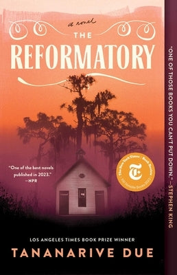 Paperback copy of The Reformatory novel by S&s/Saga Press with a dark cover featuring a prison-themed illustration.
