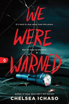 Paperback of "We Were Warned" by Sourcebooks Fire, featuring the book cover with bold title and author name.