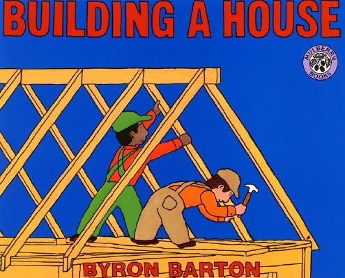 Paperback book titled "Building a House" by Greenwillow Books, featuring a colorful cover illustration of a house being built.