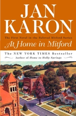 Paperback copy of "At Home in Mitford" by G.P. Putnam's Sons, featuring the book cover with title and author details.
