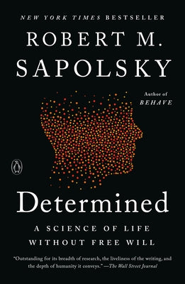 Paperback copy of "Determined: A Science of Life Without Free Will" by Penguin Books, showing the book cover design.