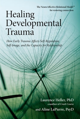 Paperback book titled "Healing Developmental Trauma" by North Atlantic Books, with a cover featuring a calming abstract design.