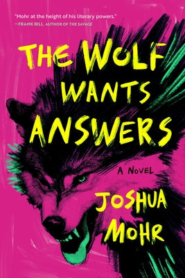 Paperback of "The Wolf Wants Answers" by Unnamed Press showing the book cover with dark wolf imagery and bold title text.