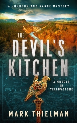 Paperback copy of The Devil's Kitchen: A Murder in Yellowstone by Severn River Publishing, showing the book cover with Yellowstone scenery.