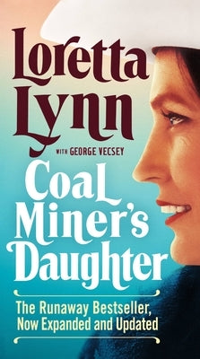 Mass market paperbound copy of Coal Miner's Daughter book by Grand Central Publishing, showing the front cover with title and author's image.
