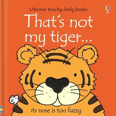 Open Usborne That's Not My Tiger board book showing colorful tiger illustrations and textured patches for young children.