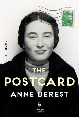 Paperback of "The Postcard" by Europa Editions, featuring a close-up of the book cover with artwork and title text.