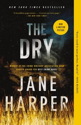 Paperback copy of "The Dry" by Flatiron Books, showing the front cover with title and author details.