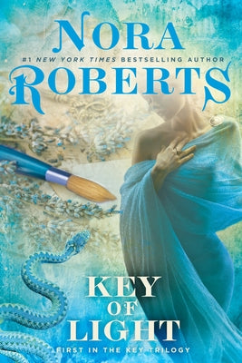 Paperback copy of "Key of Light" by Berkley Books, showing the book cover with title and author details.