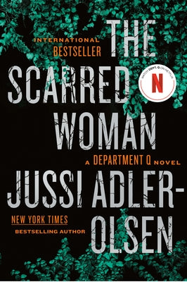 Paperback of The Scarred Woman novel by Penguin Publishing Group, featuring cover art with dark, intense imagery.